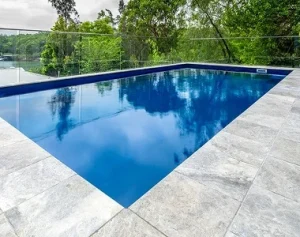 silver travertine bullnose pool coping, silver pool coping tiles, round edge pool coping, stone pavers brisbane