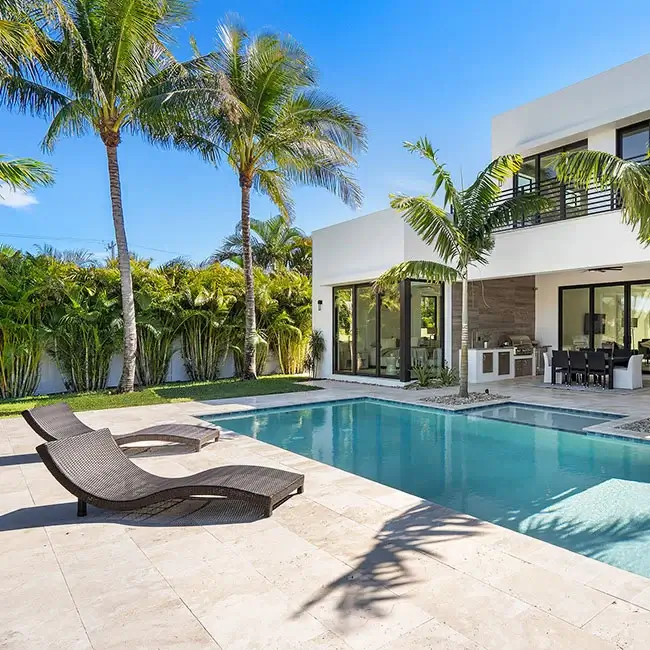 travertine tiles laid around a pool
